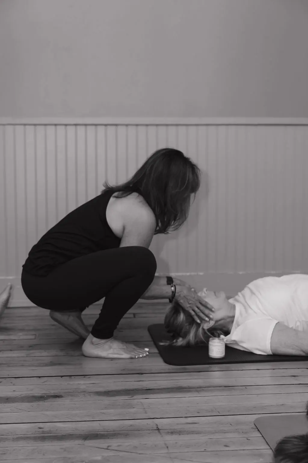 Two people engaging in a close, intimate moment on the floor.