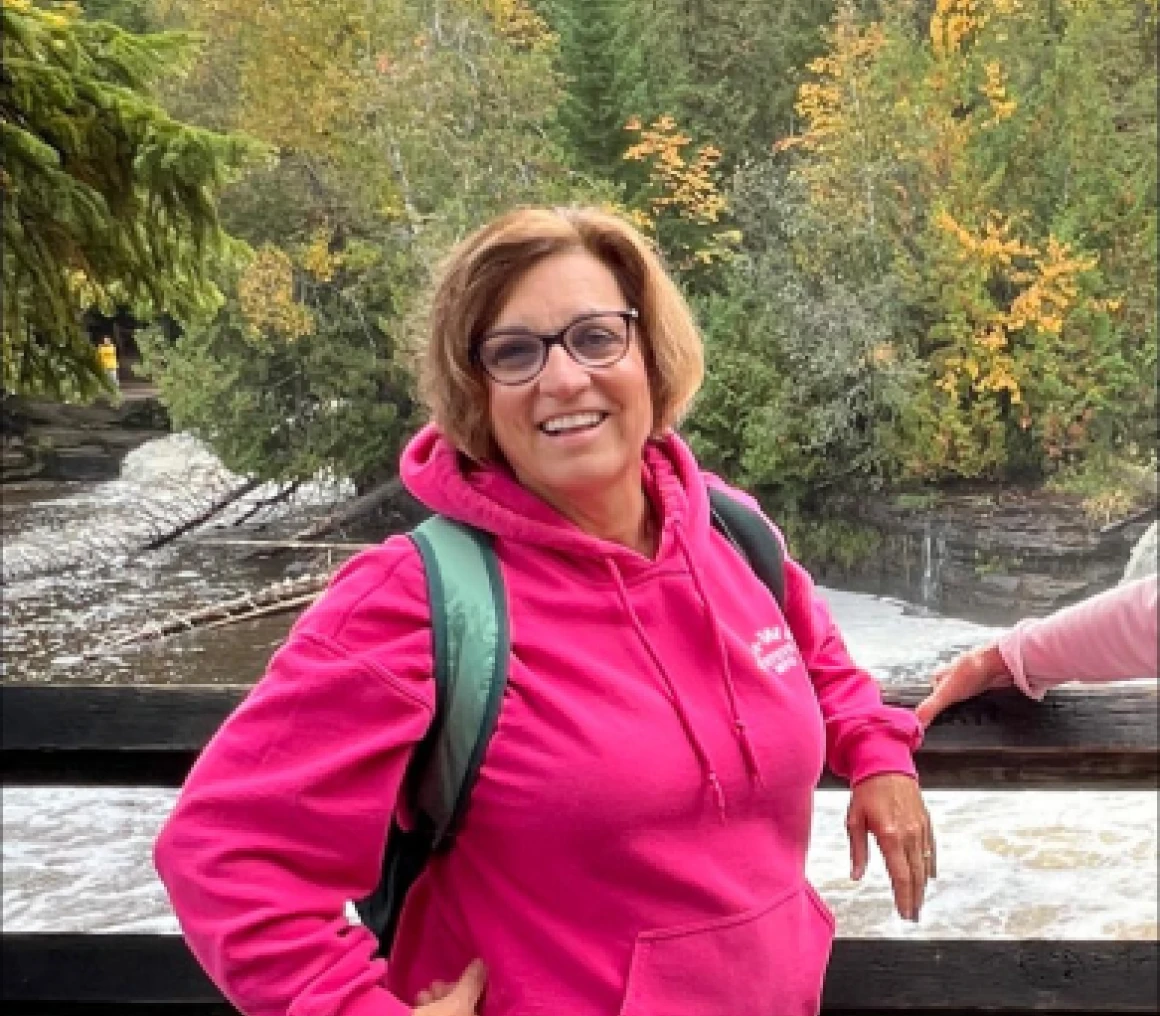 Smiling woman on a scenic nature walk